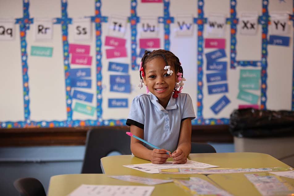 students and teacher working in classroom
