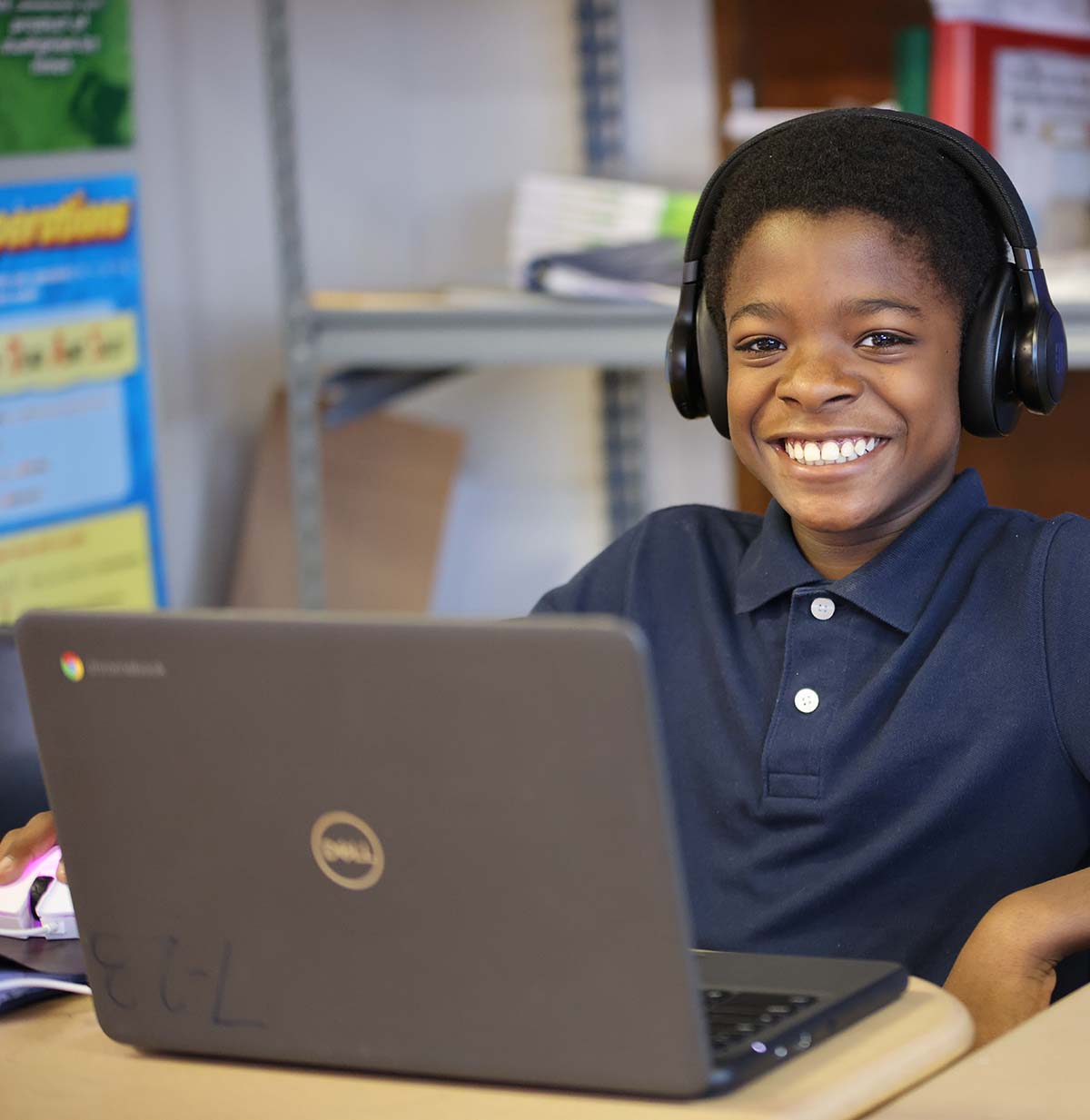 Student drawing in a classroom.